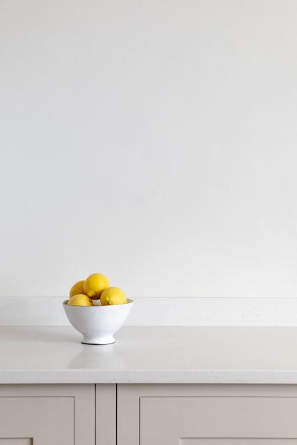 A bowl of lemons on a custom made kitchen cabinet. Commercial Photography by WHAT associates